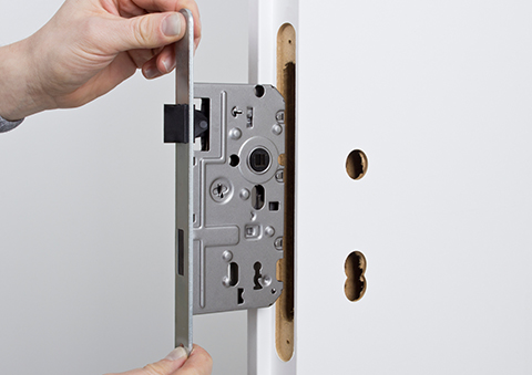a mortice lock being installed into a door
